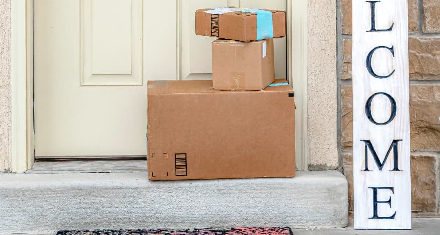 Boxes by the door of a residence with a welcome sign in Salinas